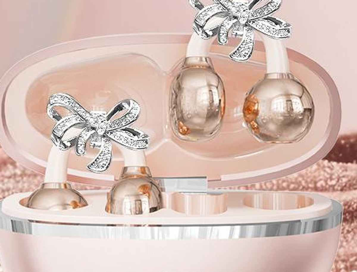 Écouteurs-bijoux Son'elle or rose avec charms nœud, dans leur boîtier