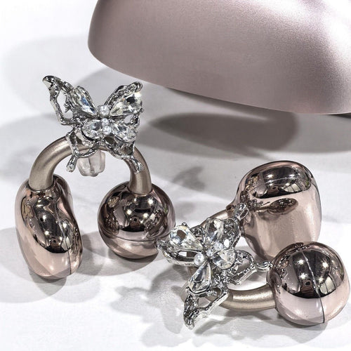 Charms papillon en cristal et perles clipsés sur les écouteurs-bijoux Son'elle or rose